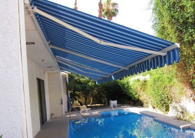 Blue Retractable Awning Over Pool